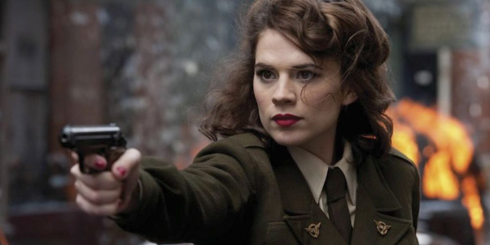 Peggy Carter fires her gun on a Hydra agent in Captain America