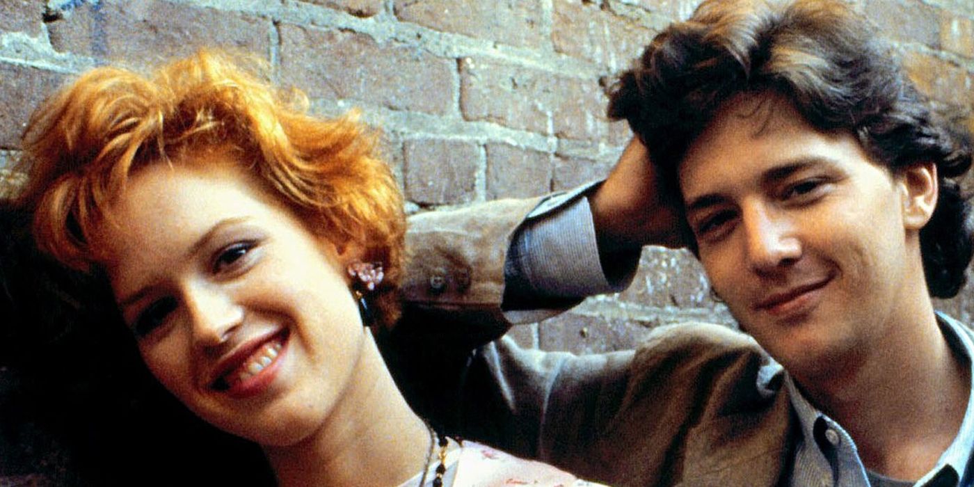 Molly Ringwald &amp; Andrew McCarthy lean against a wall in Pretty in Pink.