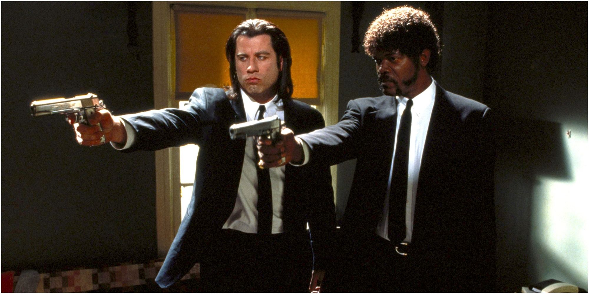 Characters pointing guns in Pulp Fiction