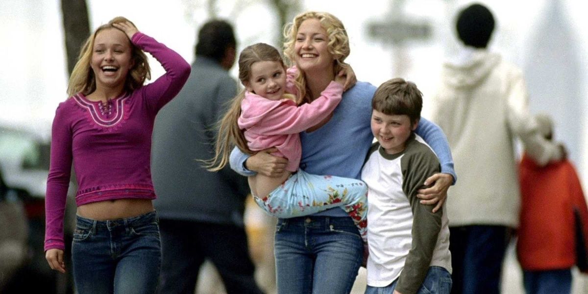 Helen, Audrey, Henry, and Sarah smiling and walking down the street in Raising Helen