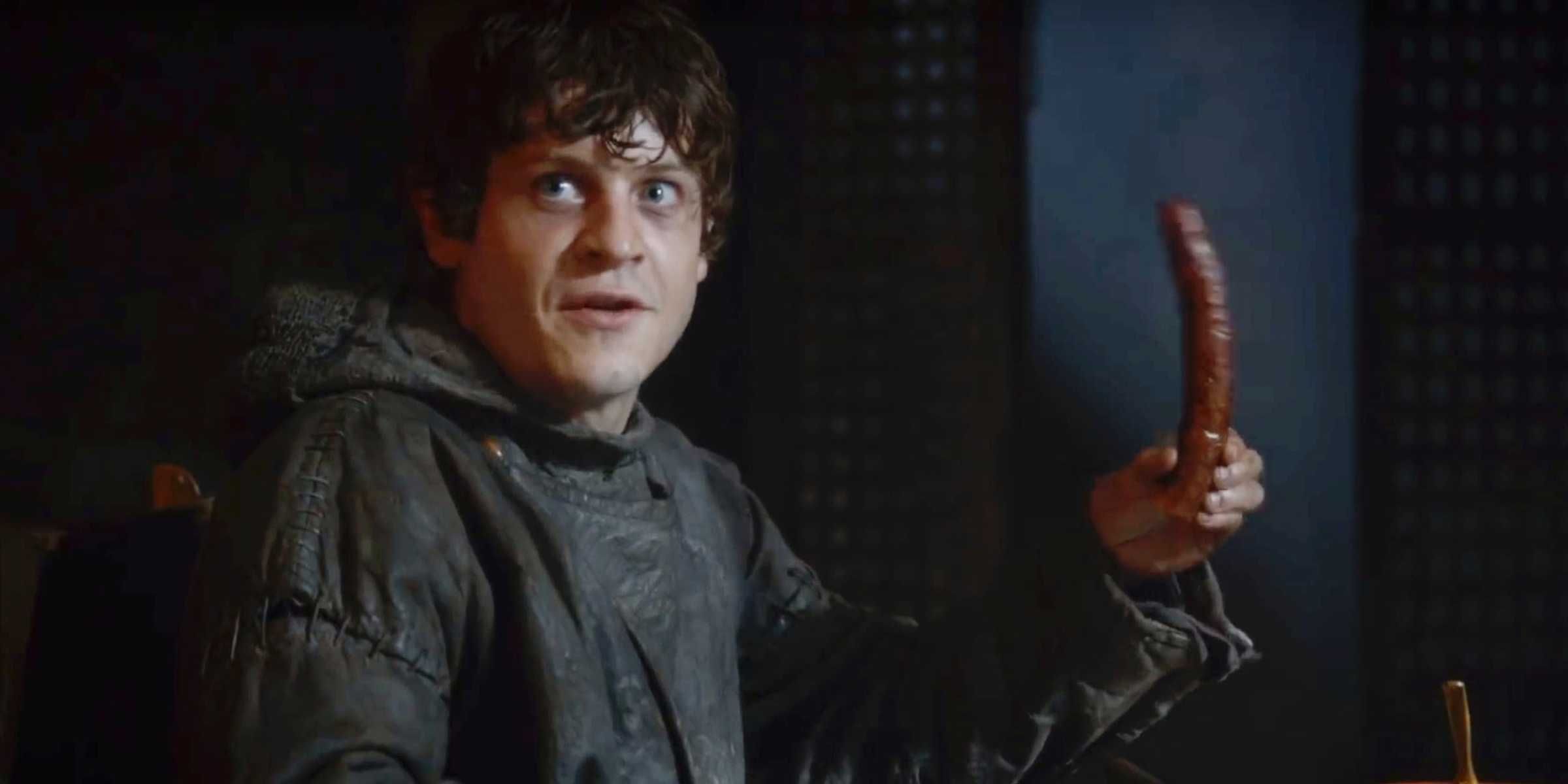 Ramsay holding a sausage in Game of Thrones