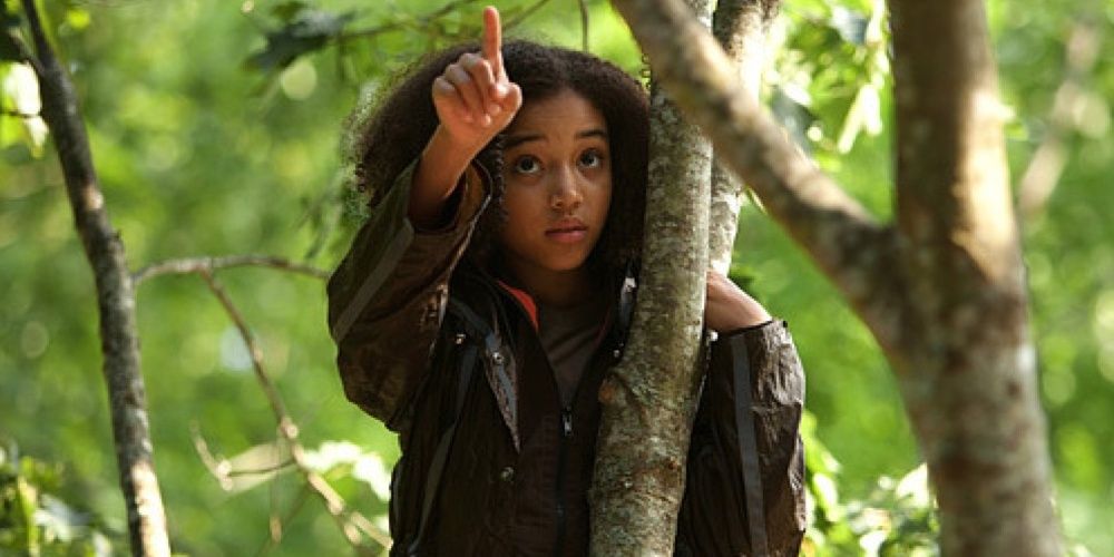Rue points above her in the trees in The Hunger Games