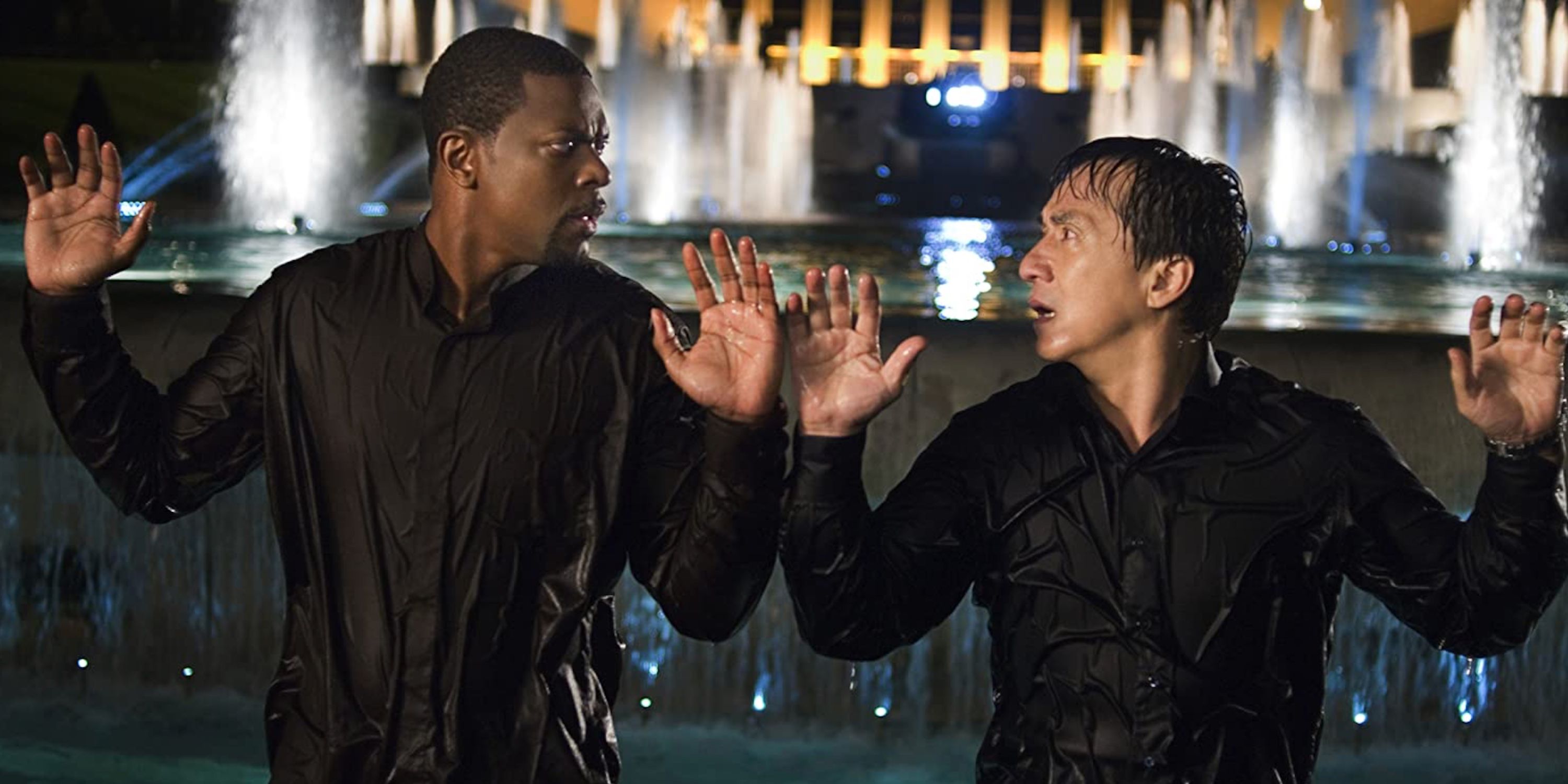 Chris Tucker and Jackie Chan holding up their hands while wet in Rush Hour 3