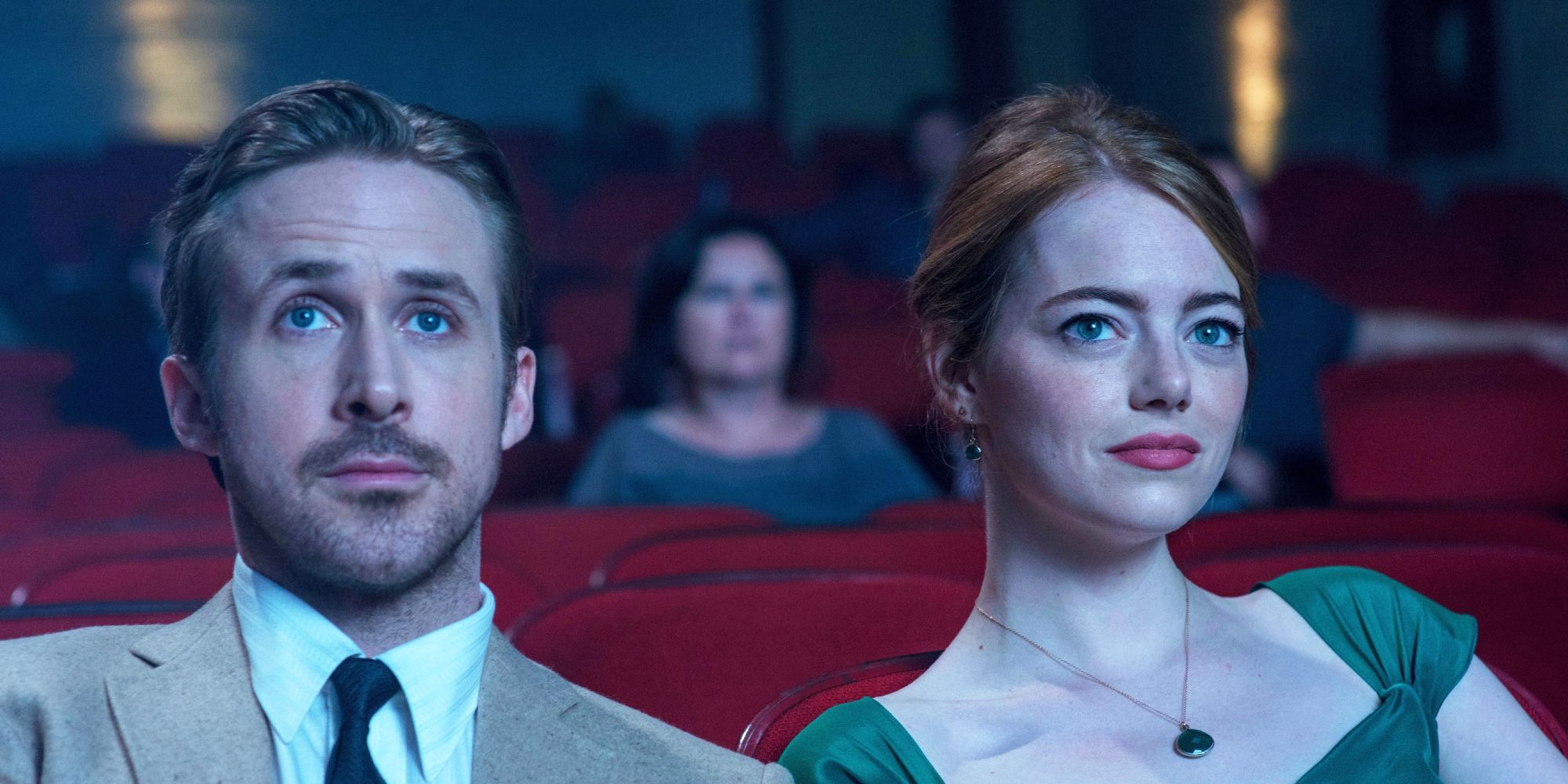 Sebastian and Mia sit in a movie theatre together in La La Land