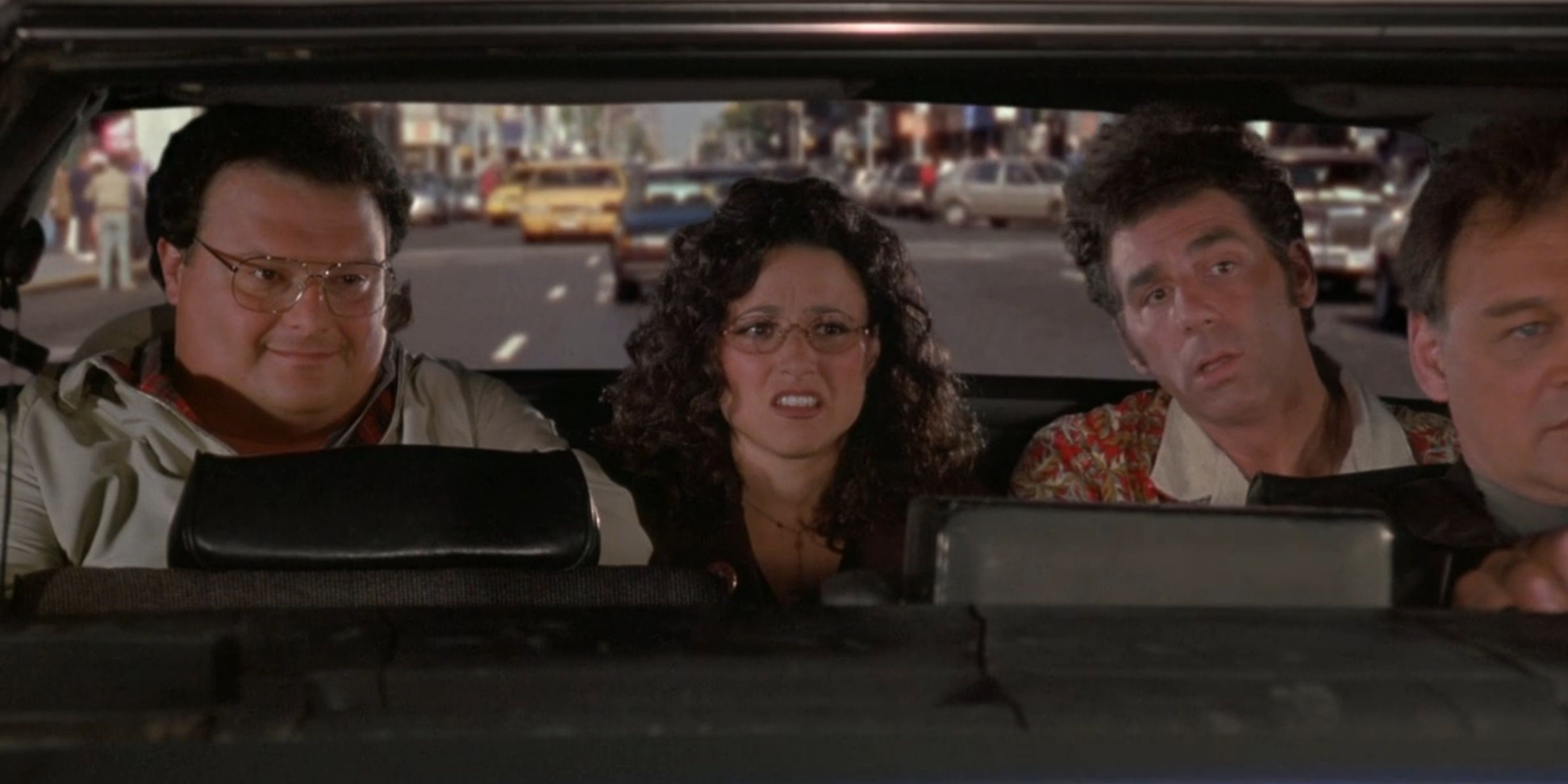 Kramer Newman and Elaine in a police car in Seinfeld