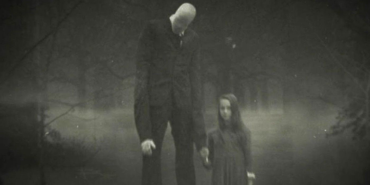 The Slender Man holds a young girl's hand in the woods in The Slender Man.