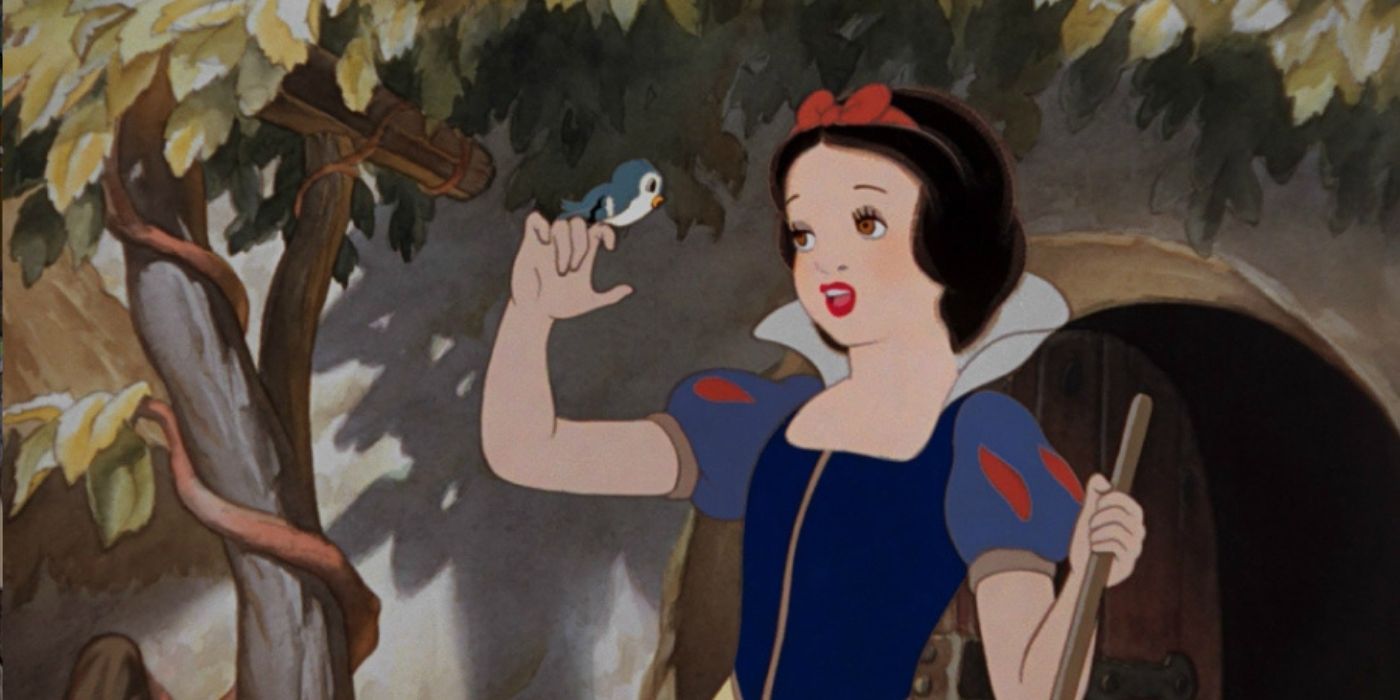 Snow White singing to a bird in Disney's Snow White in the woods hiding with her animals