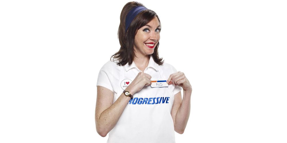 Stephanie Courtney shows off her name tag for a still in a Progressive commercial 