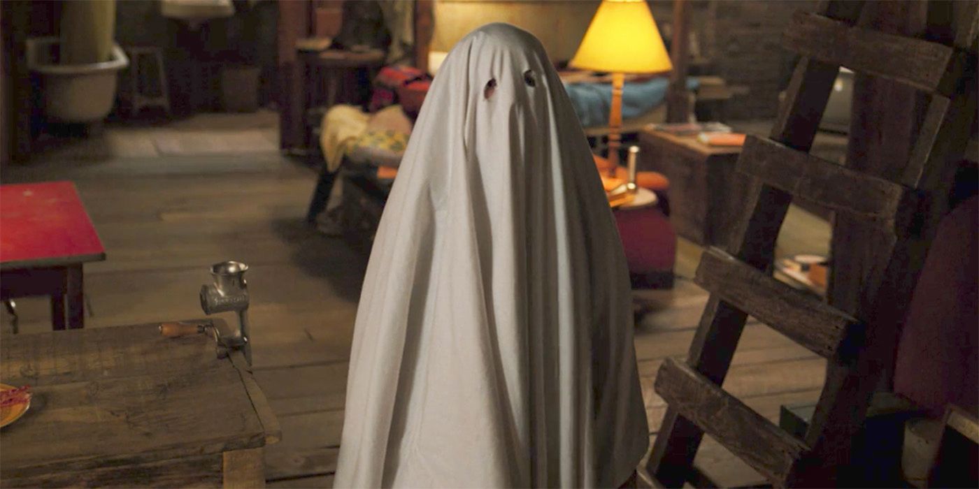 Eleven wears a sheet and pretends to be a ghost in Stranger Things Season 2
