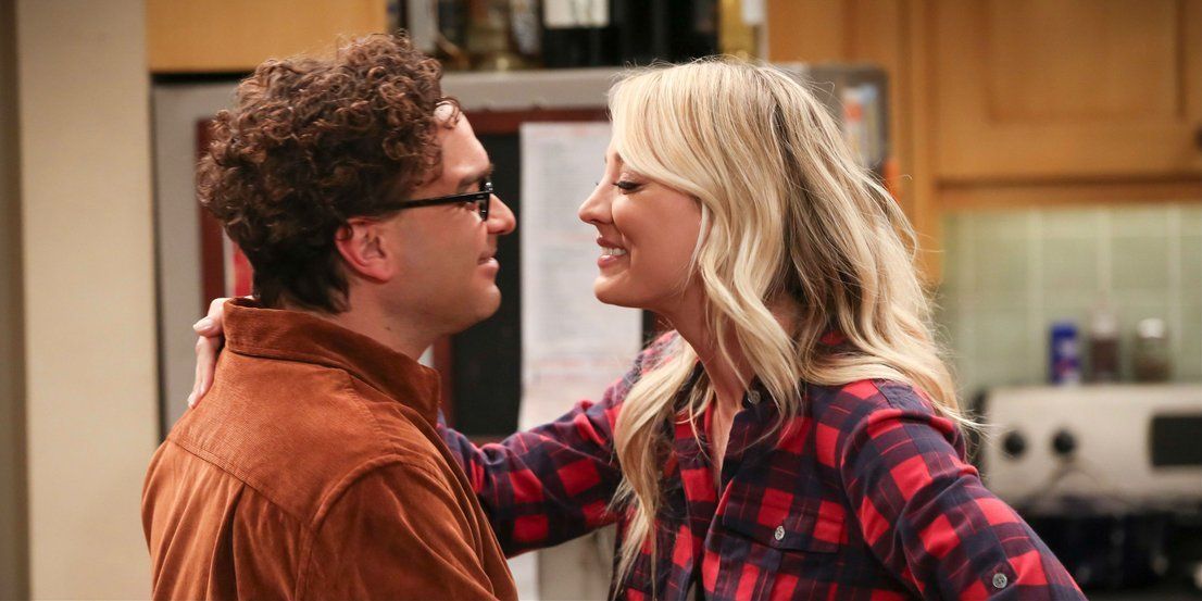 Penny and Leonard smiling and hugging each other in The Big Bang Theory
