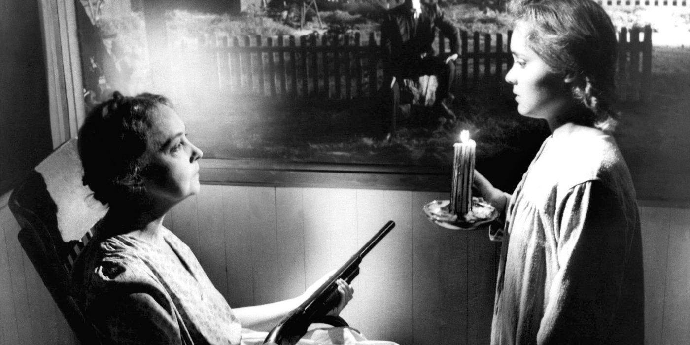 A widow holds a gun on a rocking chair in Night of the Hunter