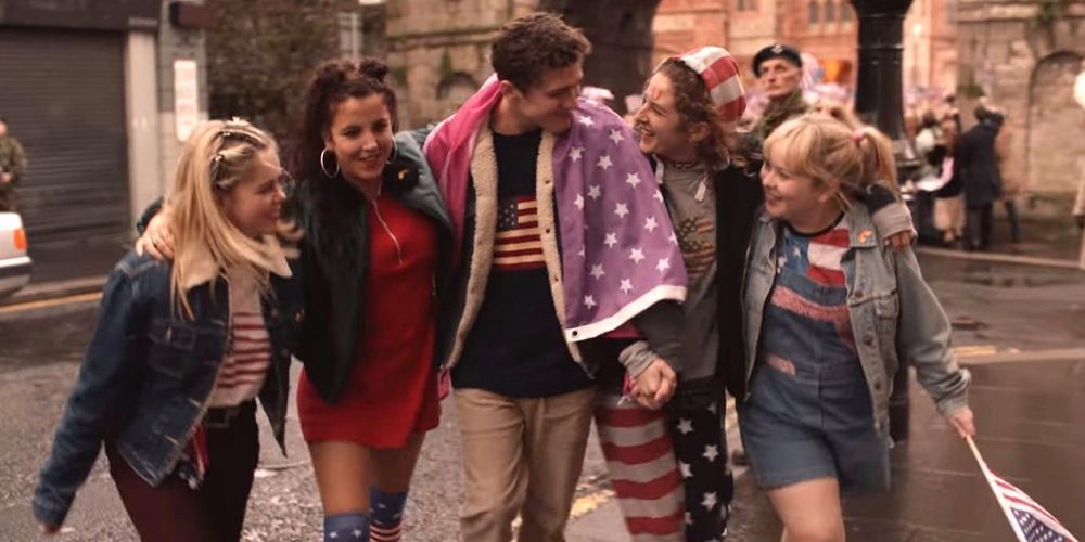 Erin, Michelle, James, Orla, and Clare were red, white, and blue apparel while walking together in Derry Girls