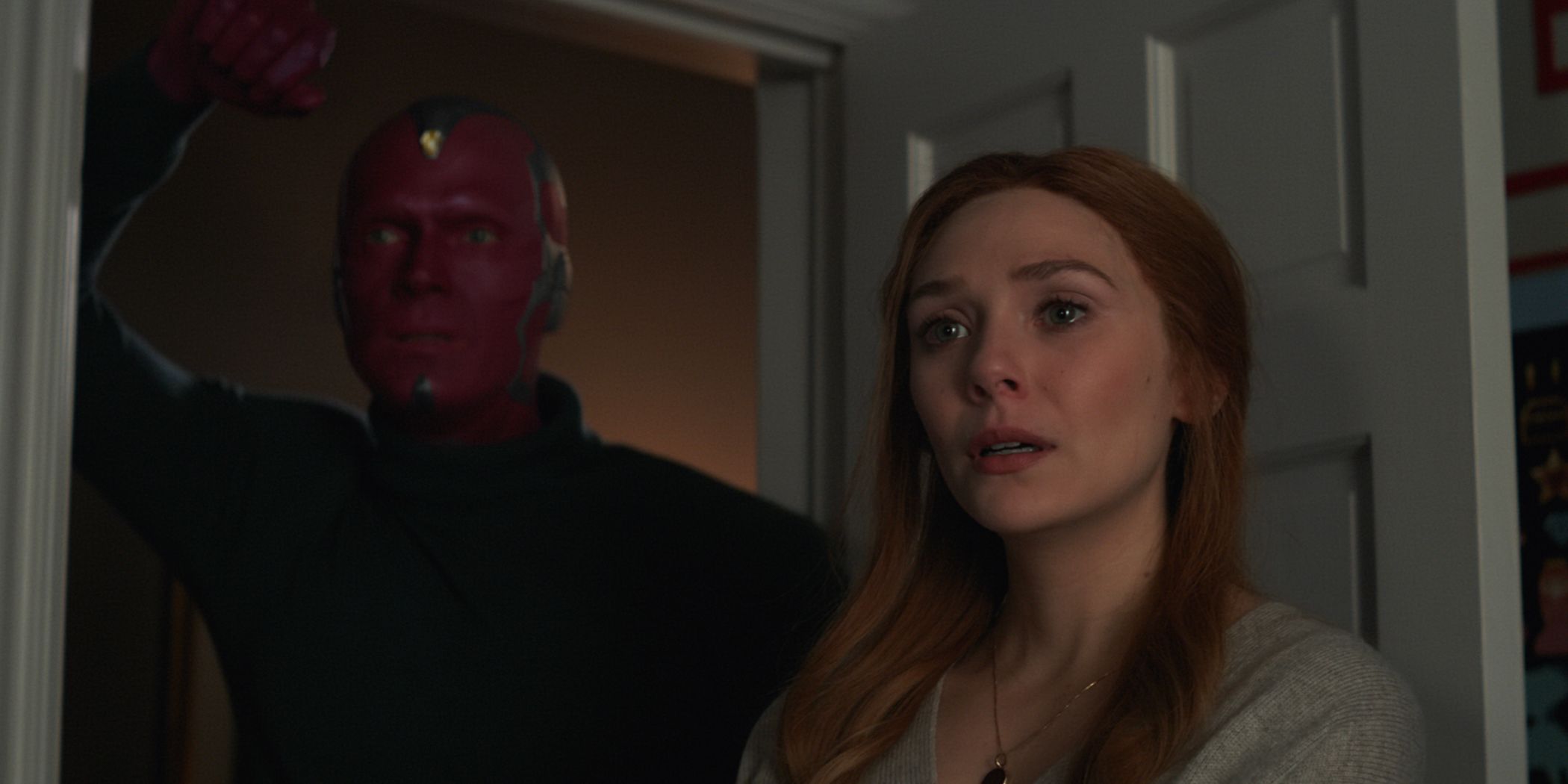 Vision and Wanda stand in the bedroom doorway to speak to their sons in WandaVision