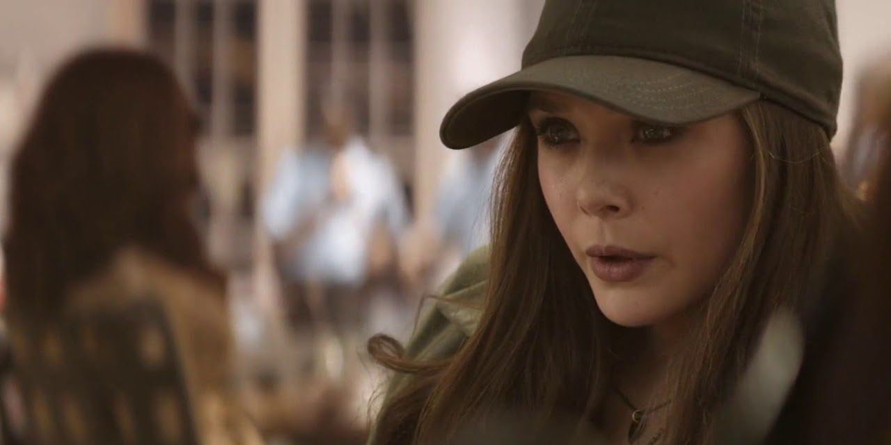 Wanda wearing a cap and looking worried in Captain America: Civil War