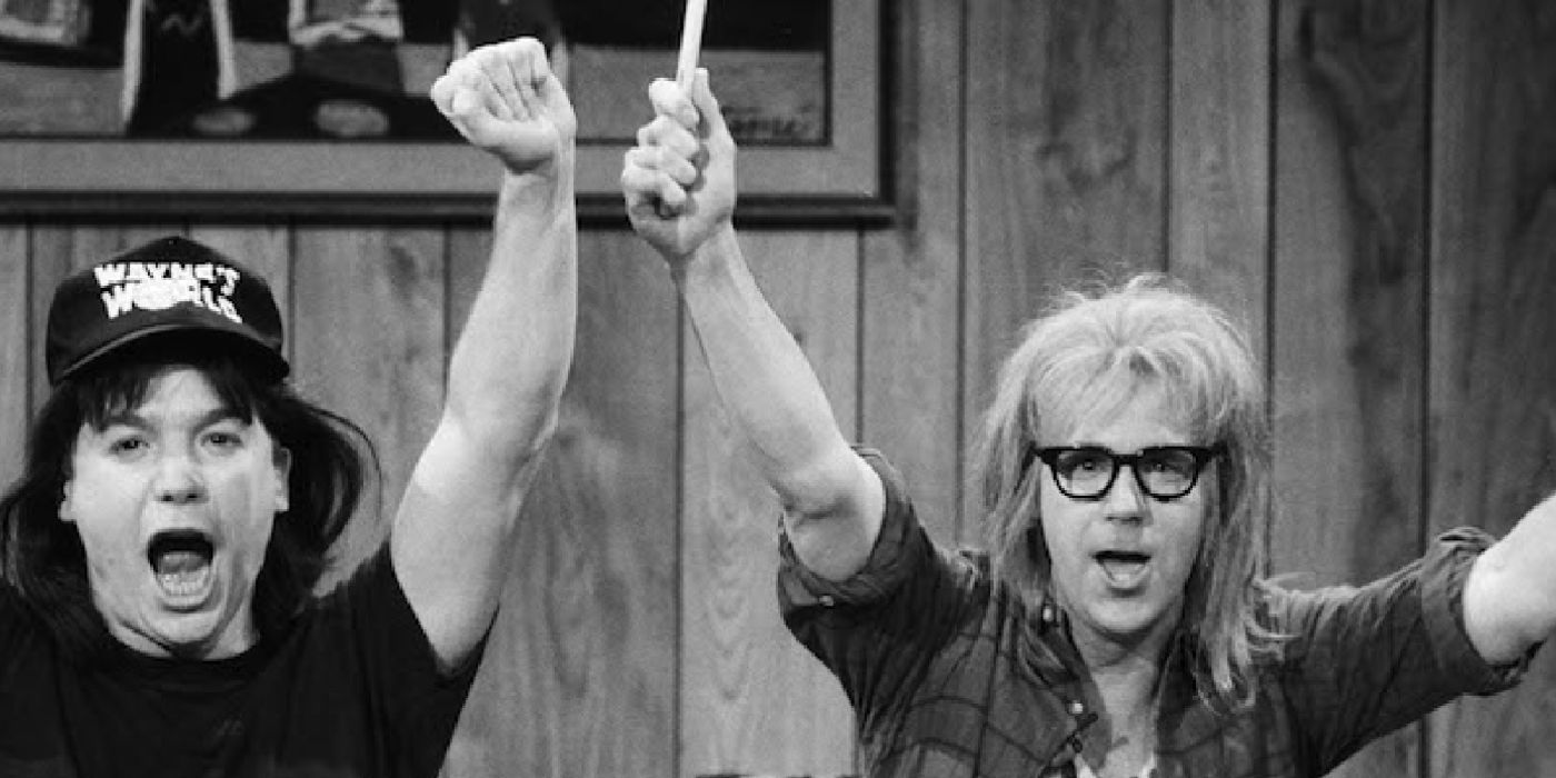 Wayne and Garth raise their arms in the air from the Wayne's World sketch on SNL