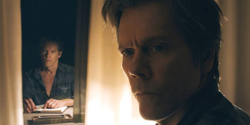 Kevin Bacon as Theo looking over his shoulder while his reflection from a memory is apparent in You Should Have left