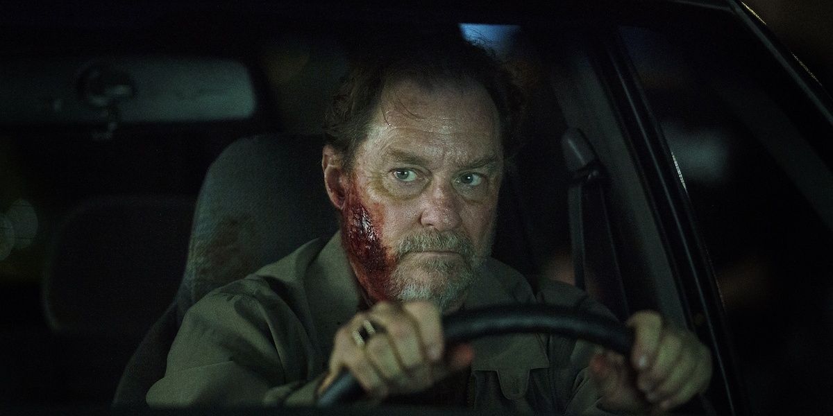 Fuchs in a car and with blood on his face in Barry