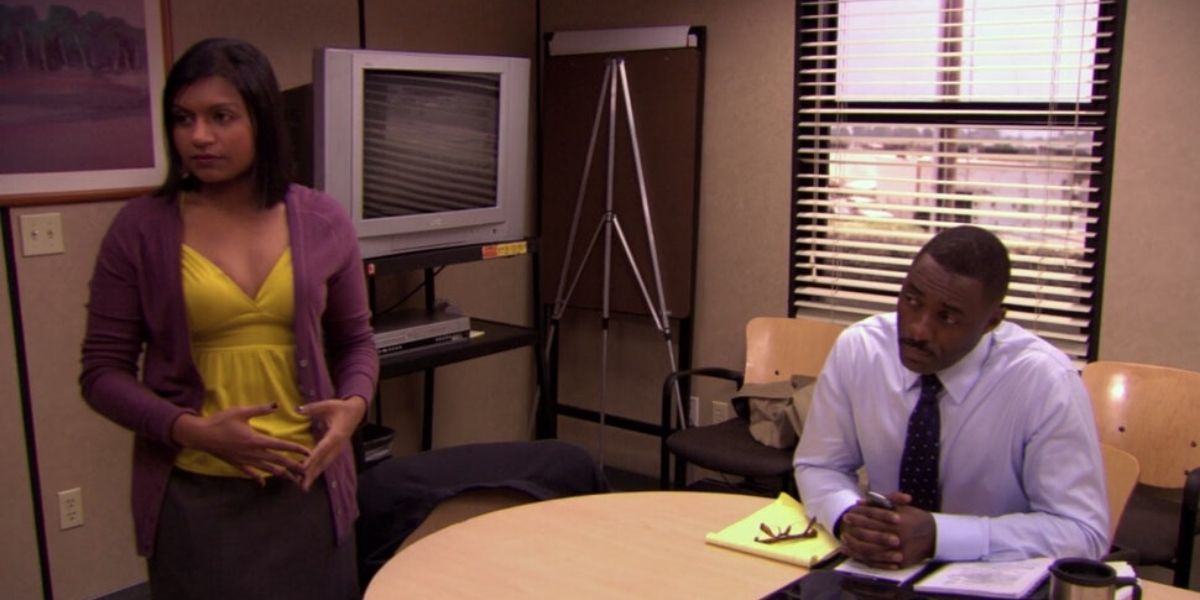 Kelly in the conference room with Charles on The Office