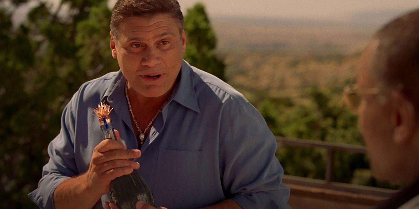 Don Eladio holds the Tequila bottle Gus gave him in Breaking Bad