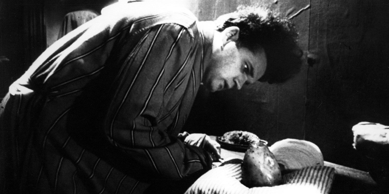 Eraserhead: Henry Spencer looking at the deformed baby.