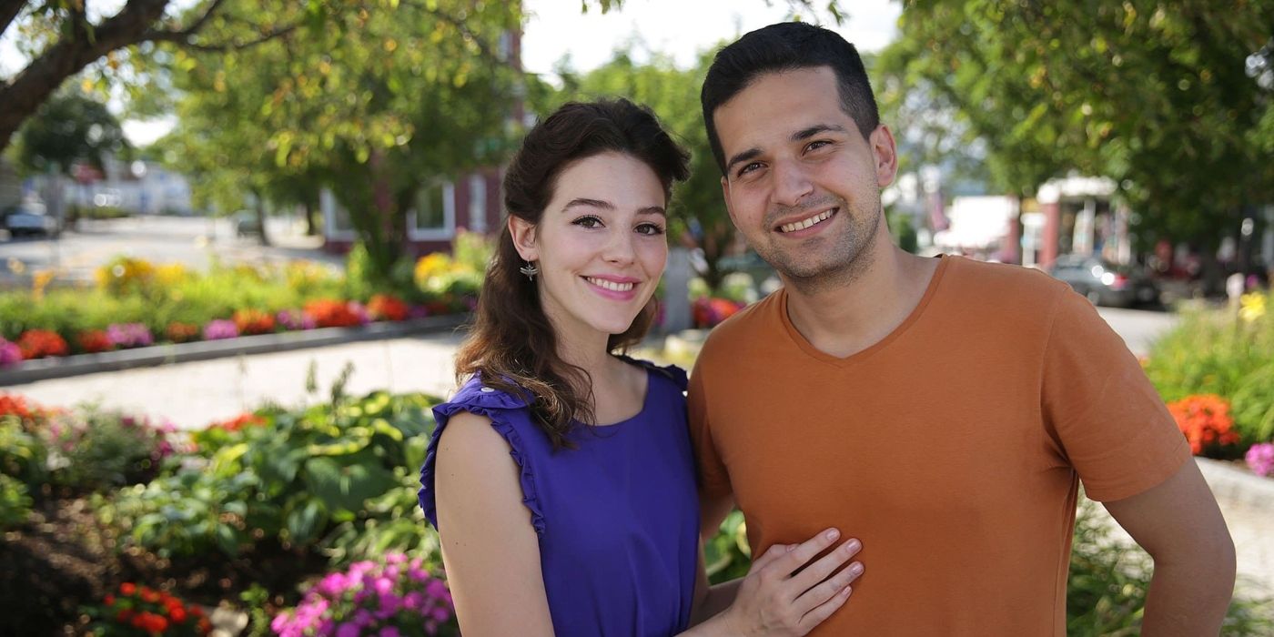 Evelyn and David posing in a garden and smiling in 90 Day Fiancé.