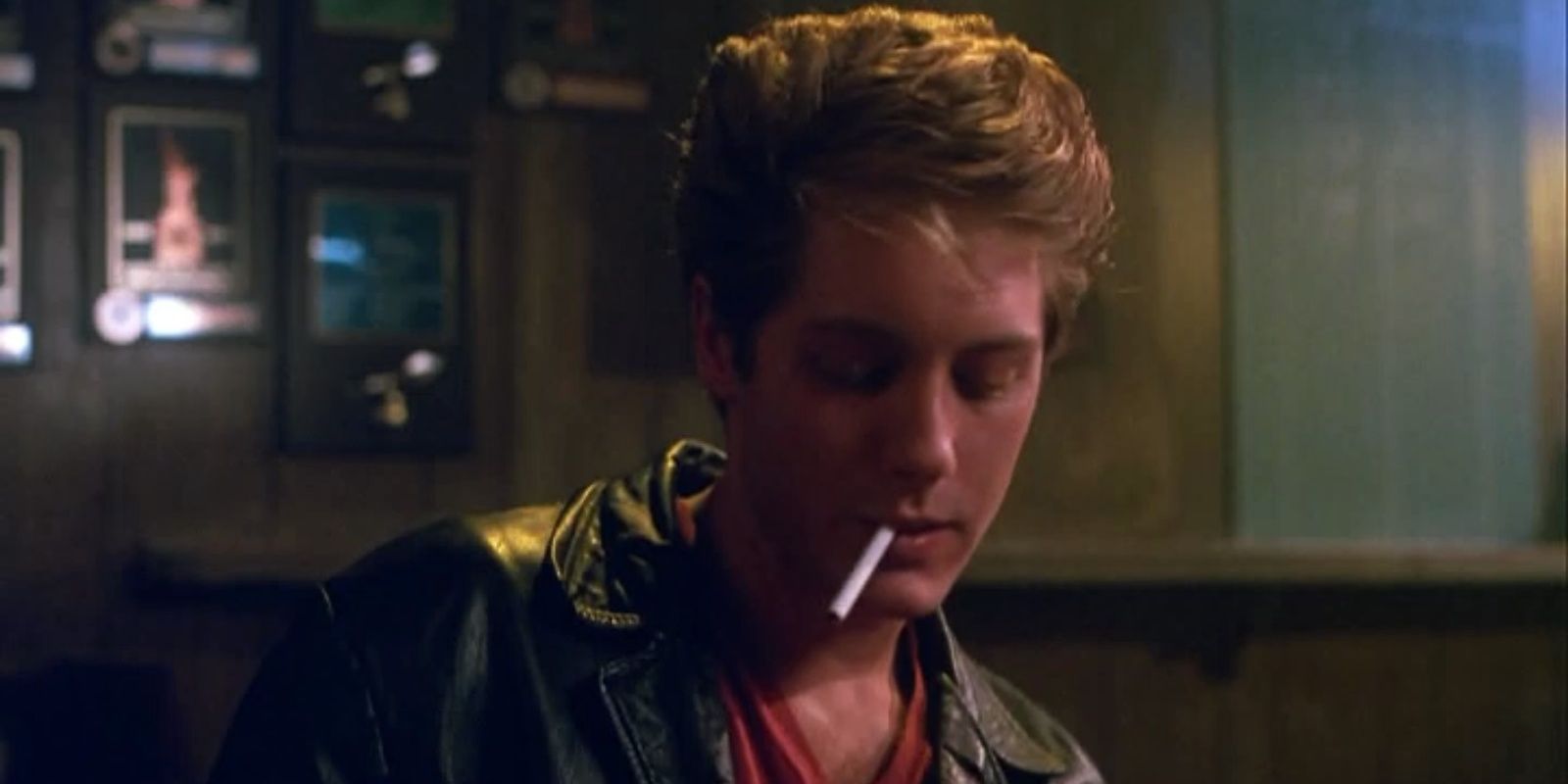 James Spader in Jack's Back, looking down and smoking a cigarette.