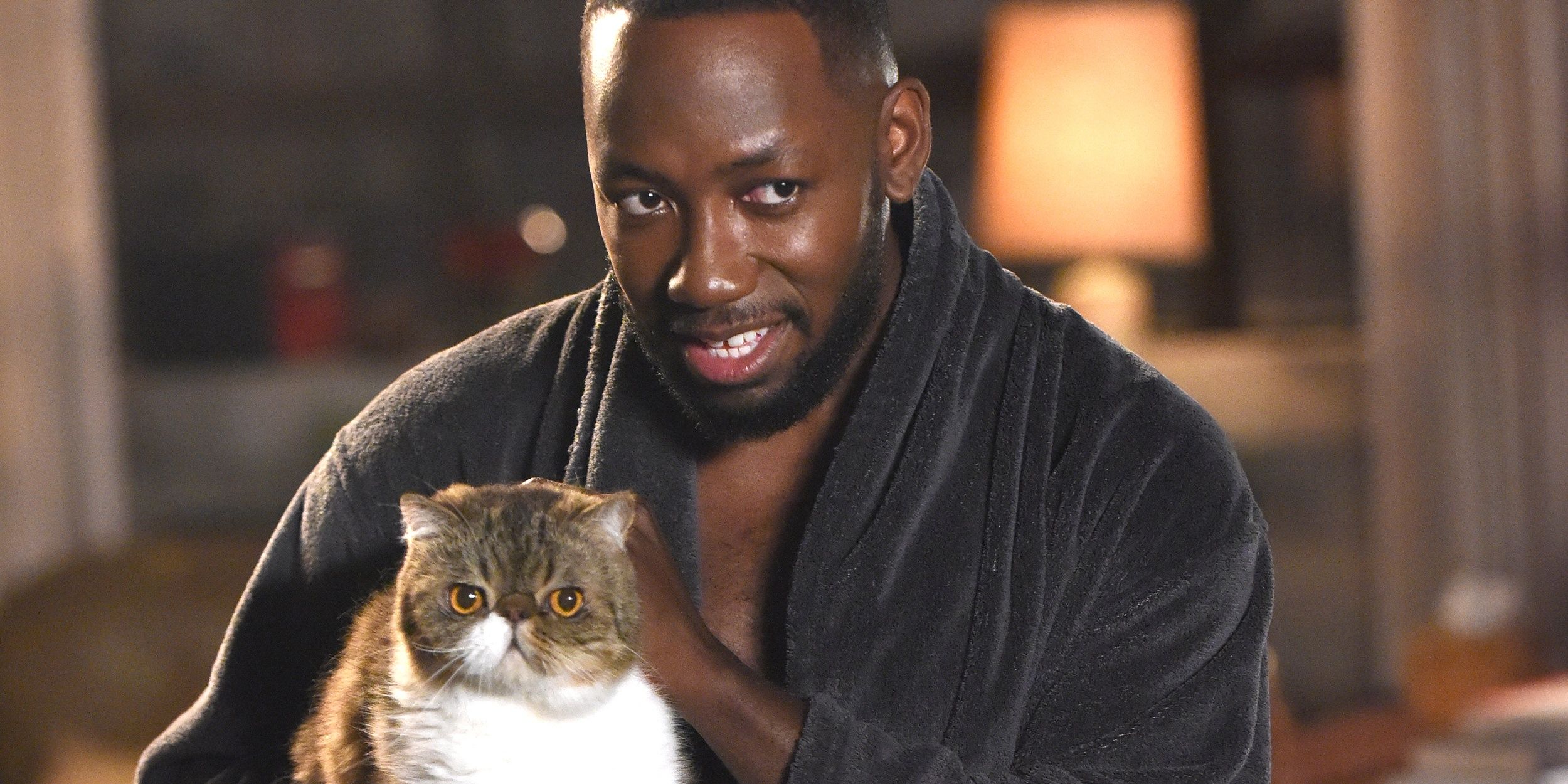 Winston petting his cat in New Girl