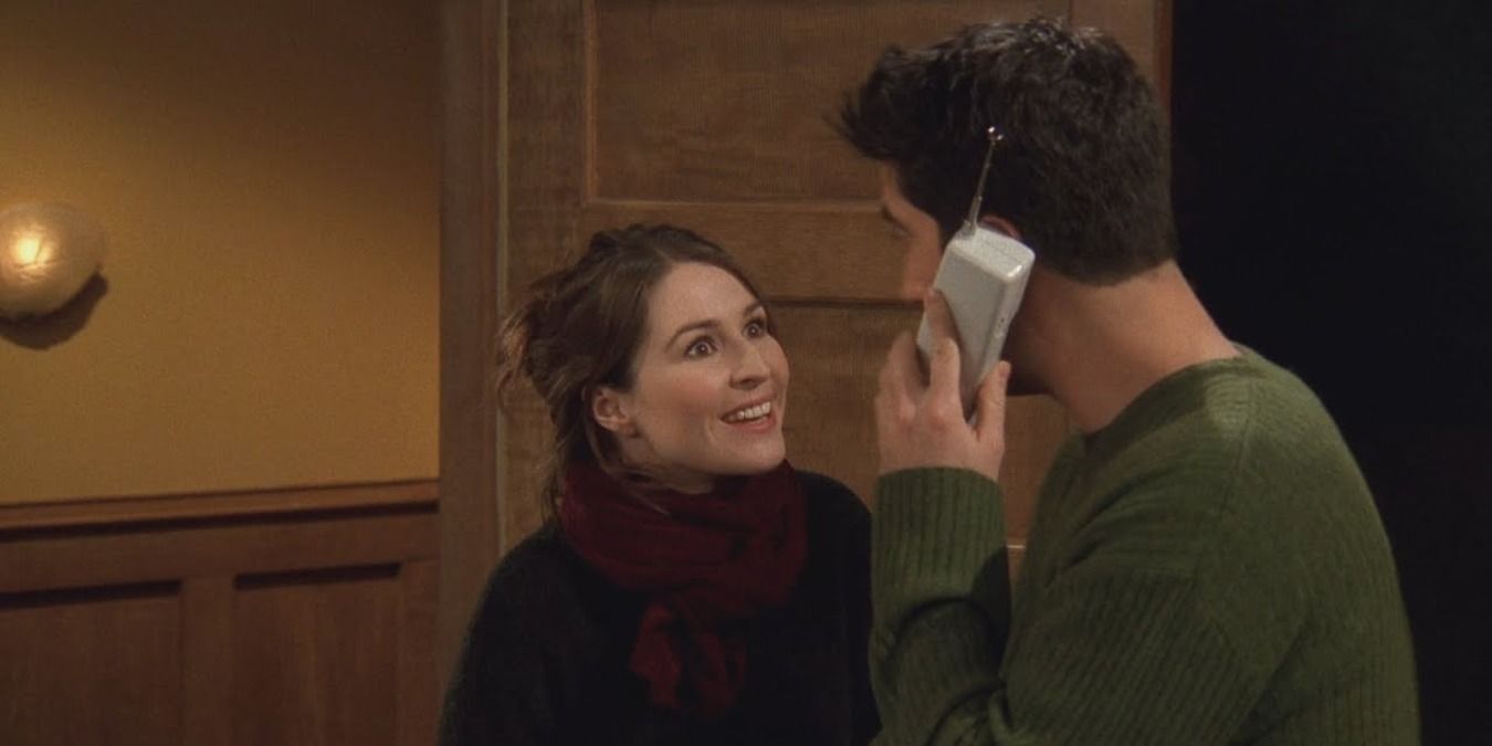 Emily smiling at Ross while he's on the phone in Friends.