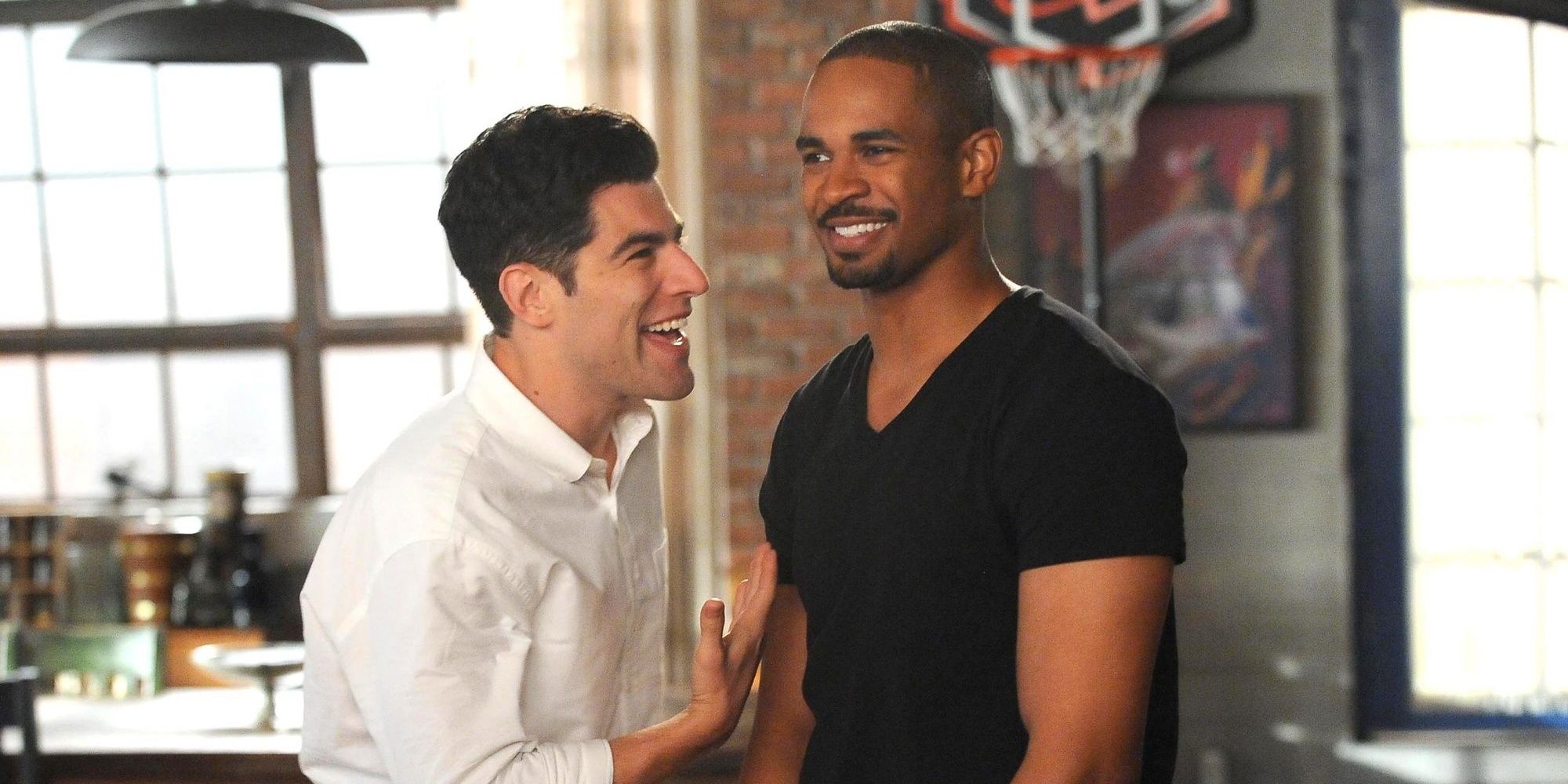 Schmidt and Coach laughing in New Girl. 
