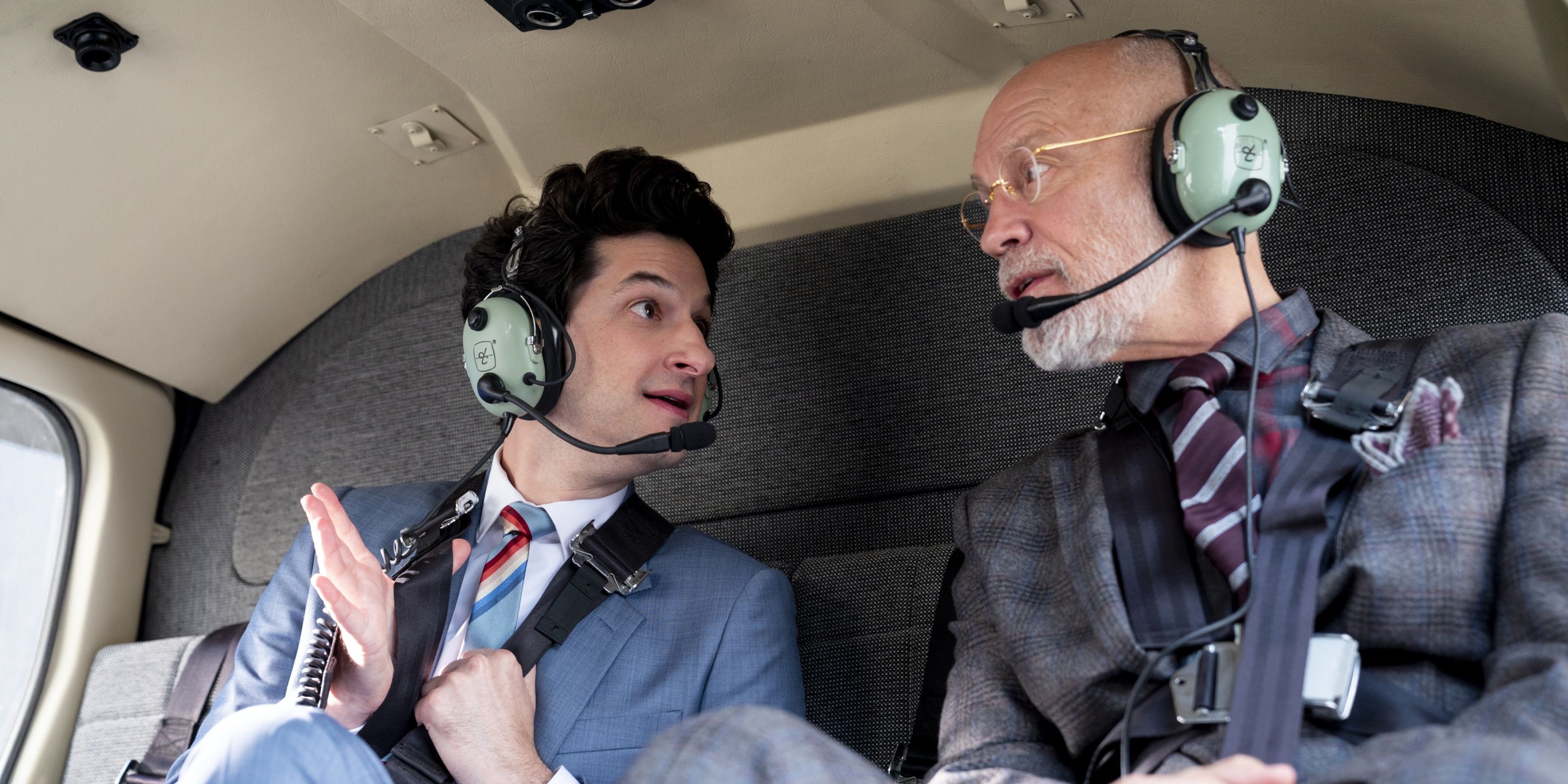 Two men in a plane wearing headsets in a scene from Space Force.