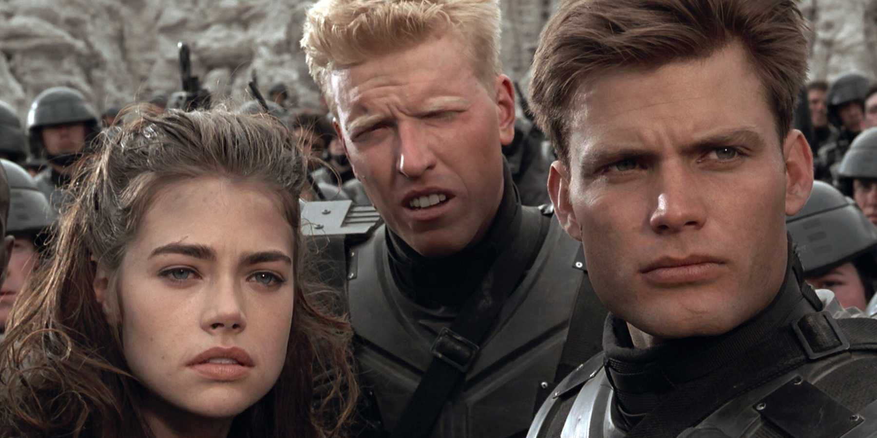 Starship Troopers' soldiers scowling while hearing bad news