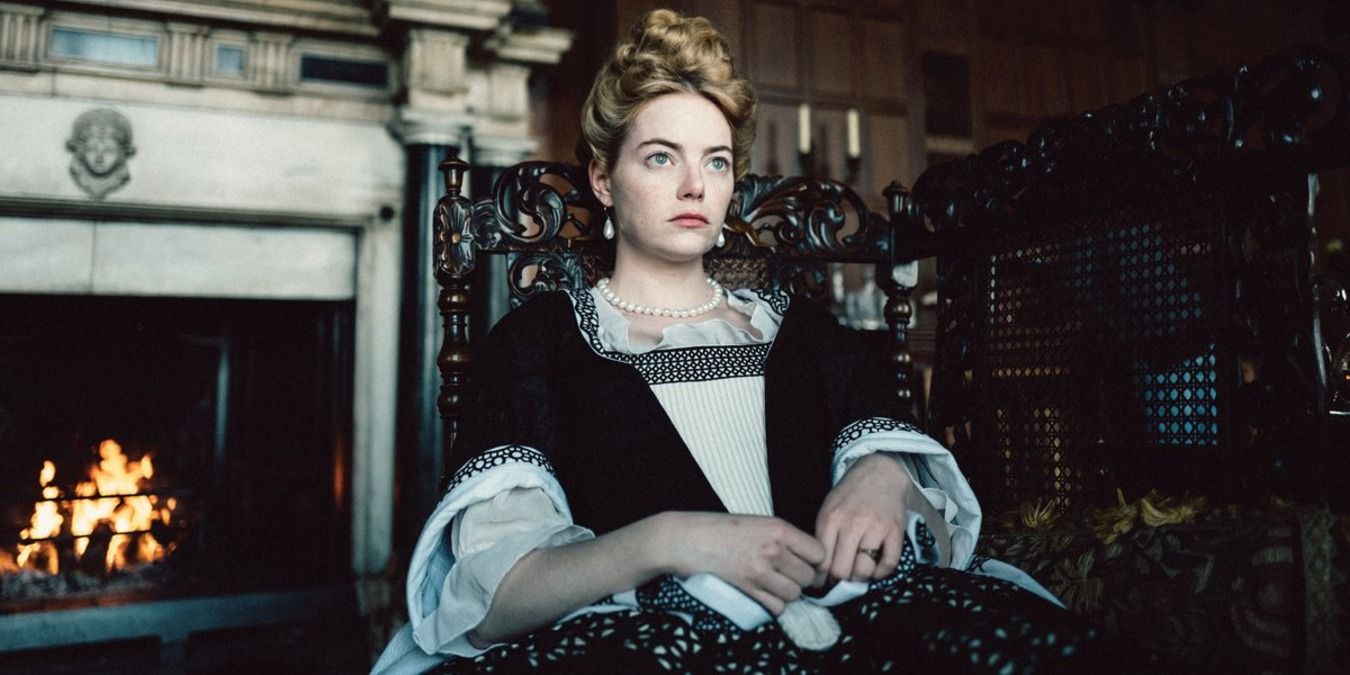 Abigail Masham sitting in a chair in The Favourite