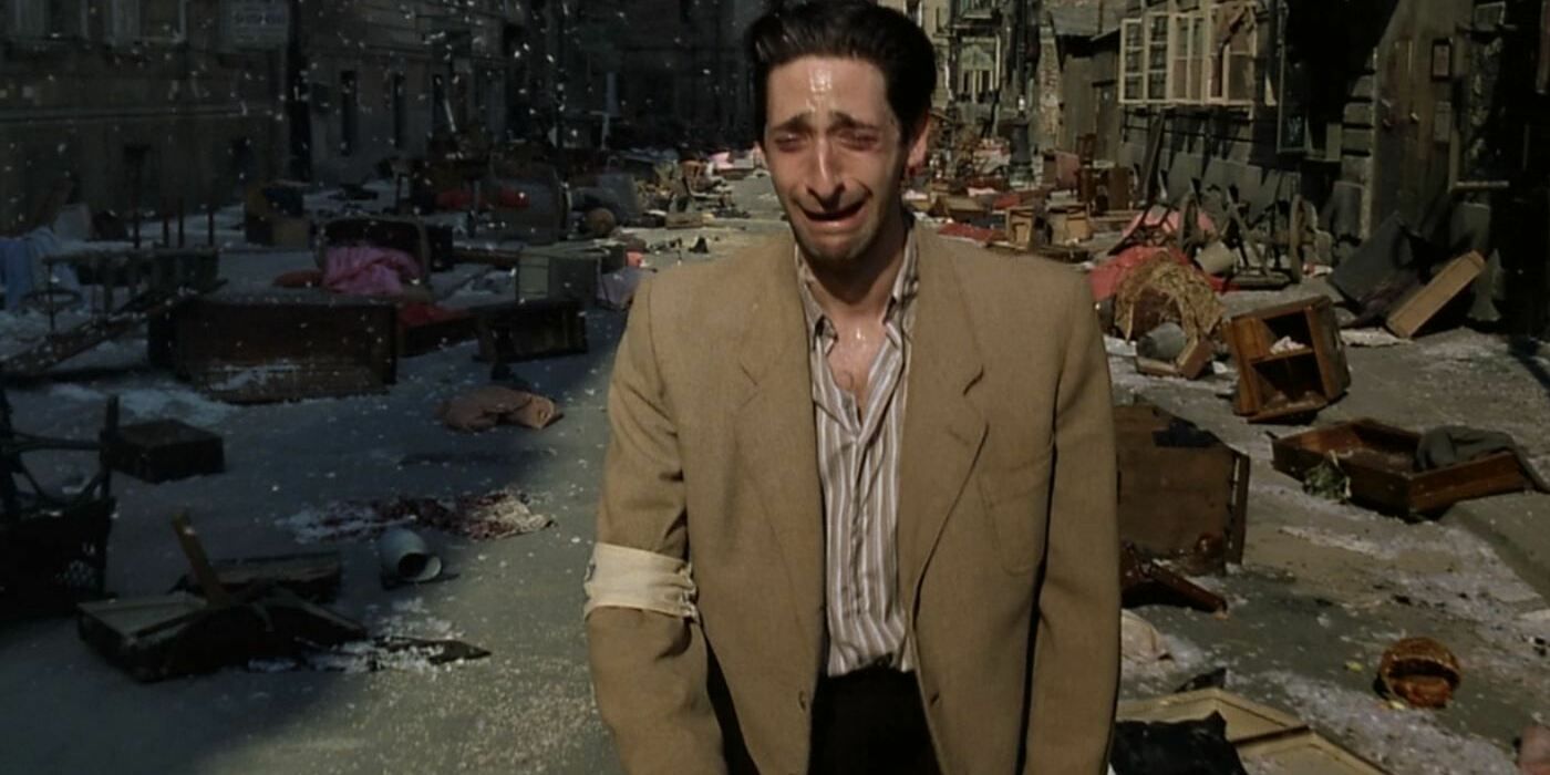 Adrien Brody as Wladyslaw Szpliman crying in the street in The Pianist.