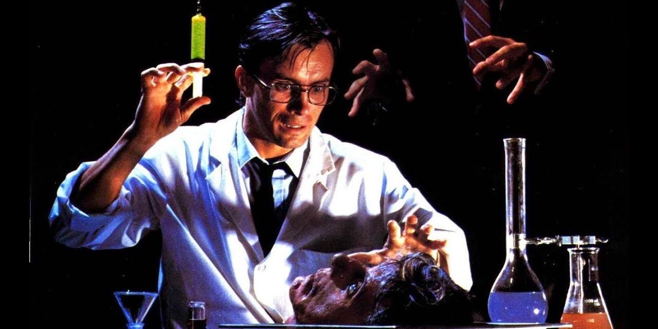 Herbert West holds a glowing syringe from Re-Animator 