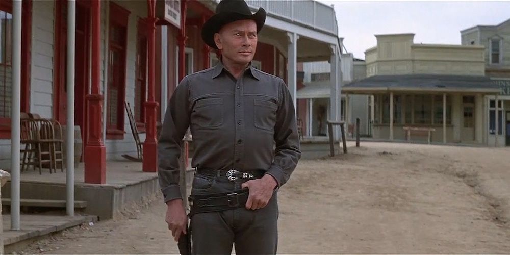 An image of an A.I. cowboy standing in the town in Westworld