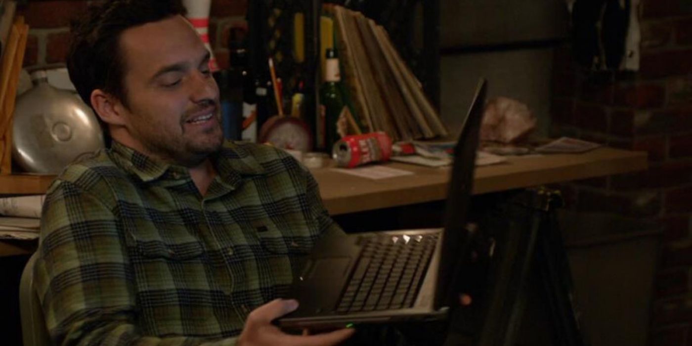 Nick in New Girl with his laptop