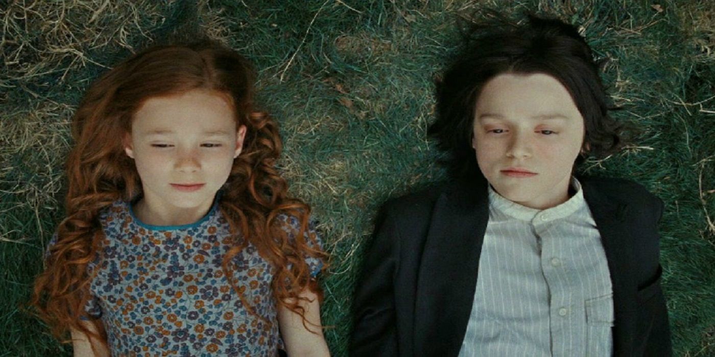 Young Snape and Lily lying on the grass in Harry Potter