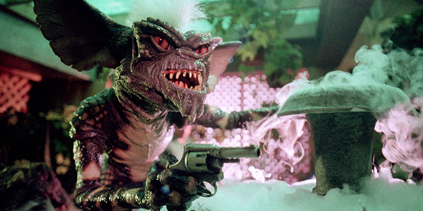 Stripe holding a pistol in the final act of Gremlins