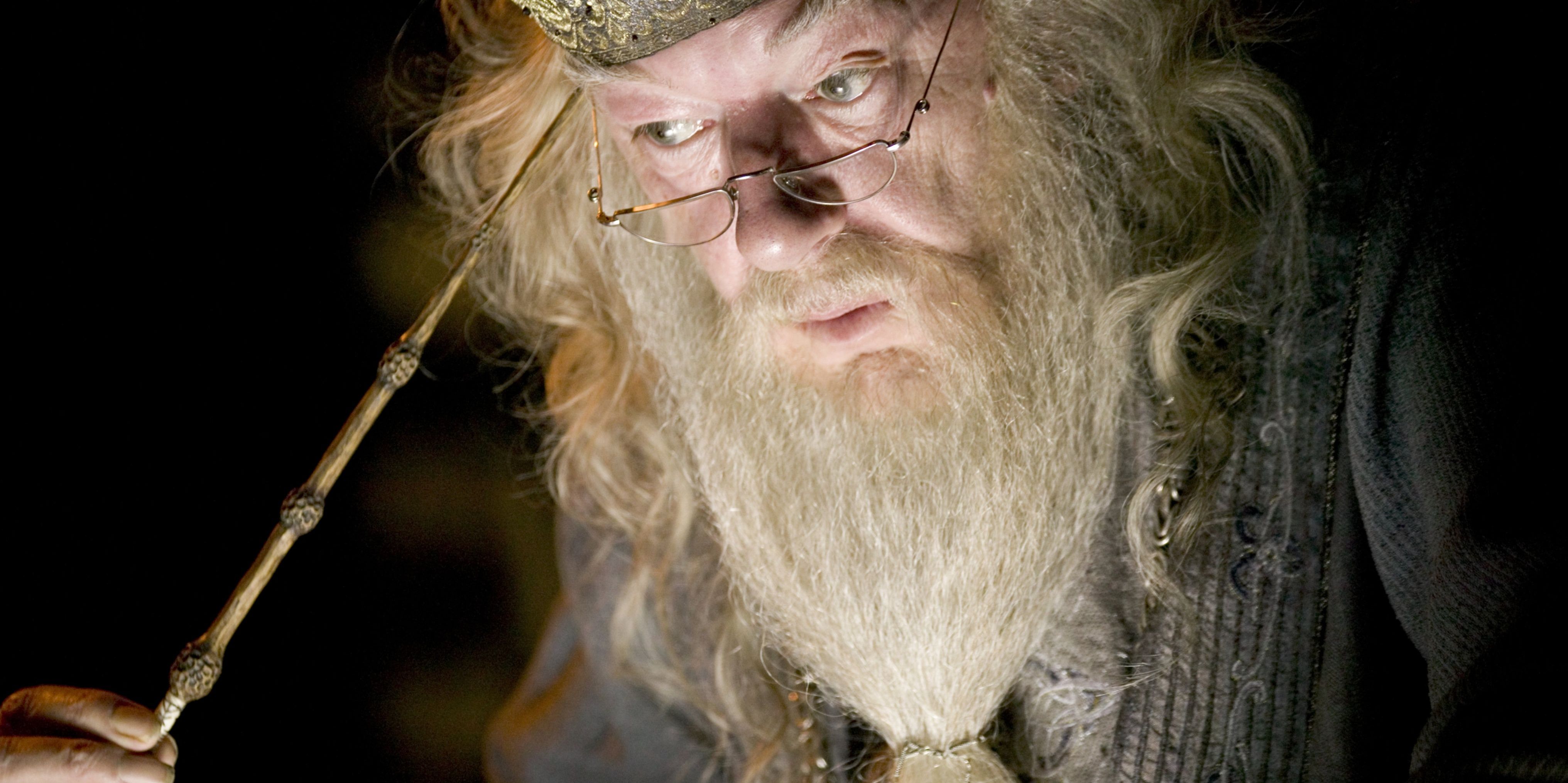 Albus Dumbledore performing a memory charm with the Elder Wand in Harry Potter.