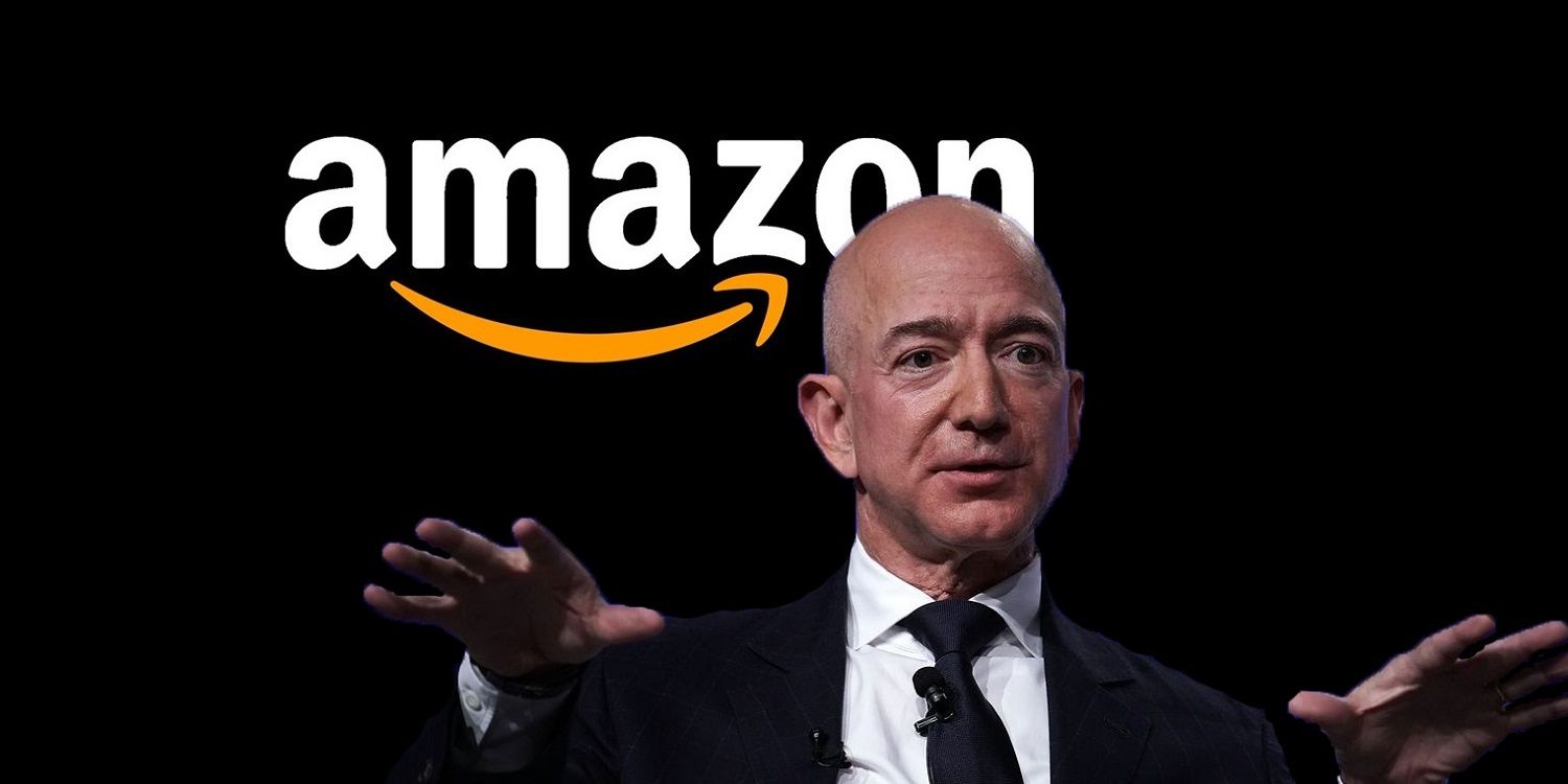 Jeff Bezos in front of the Amazon logo