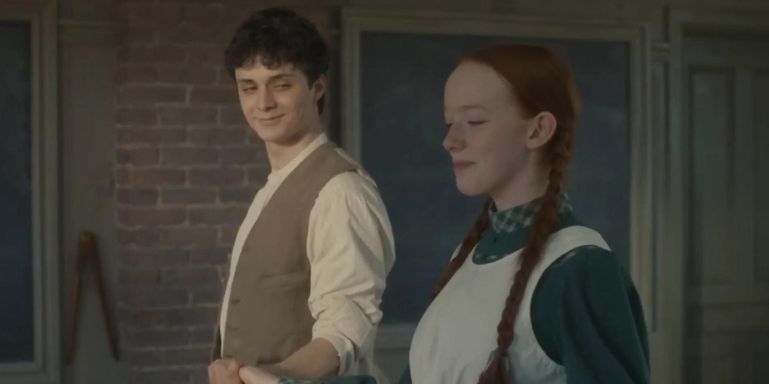 Gilbert and Anne smile while holding hands during a dance lesson in Anne With An E