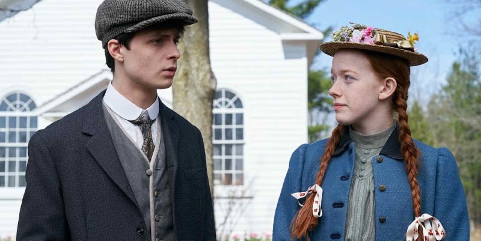 Gilbert and Anne stand together outside of the church in Anne With An E
