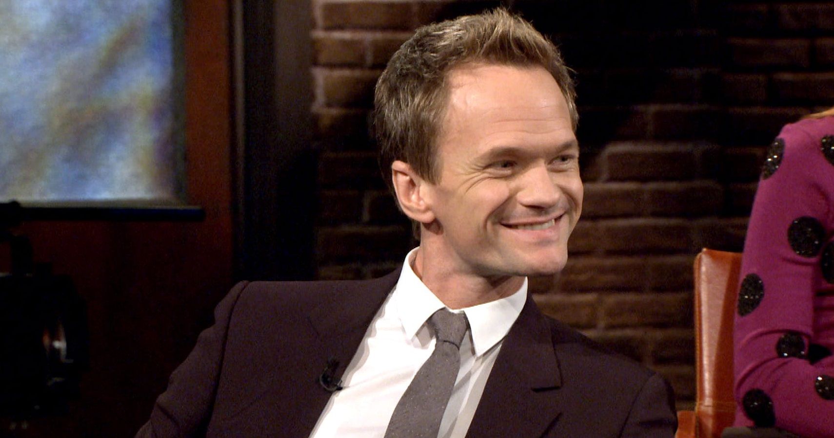 Barney smiling in How I Met Your Mother.