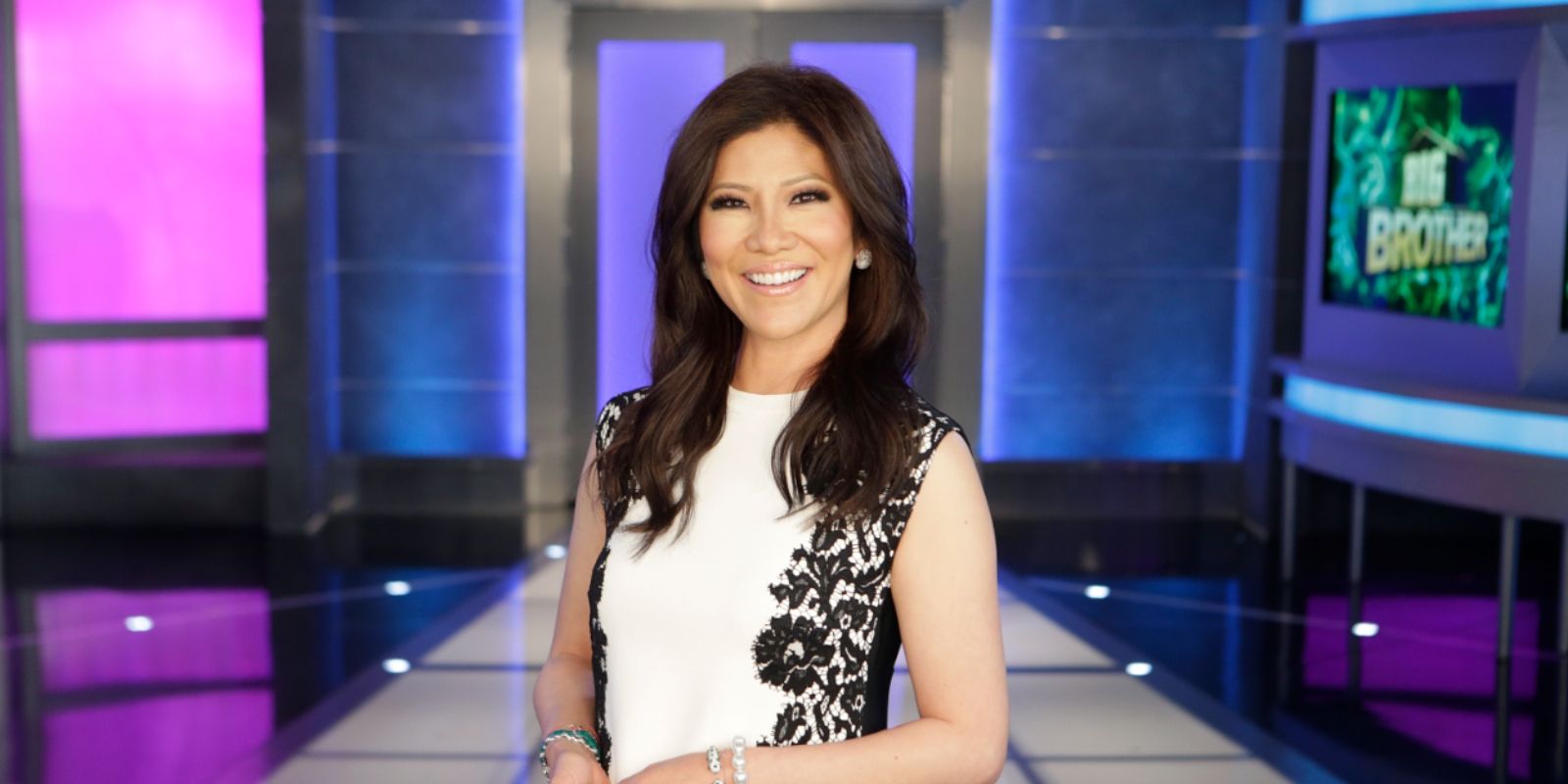 Big Brother Julie Chen on set wearing black and white dress smiling
