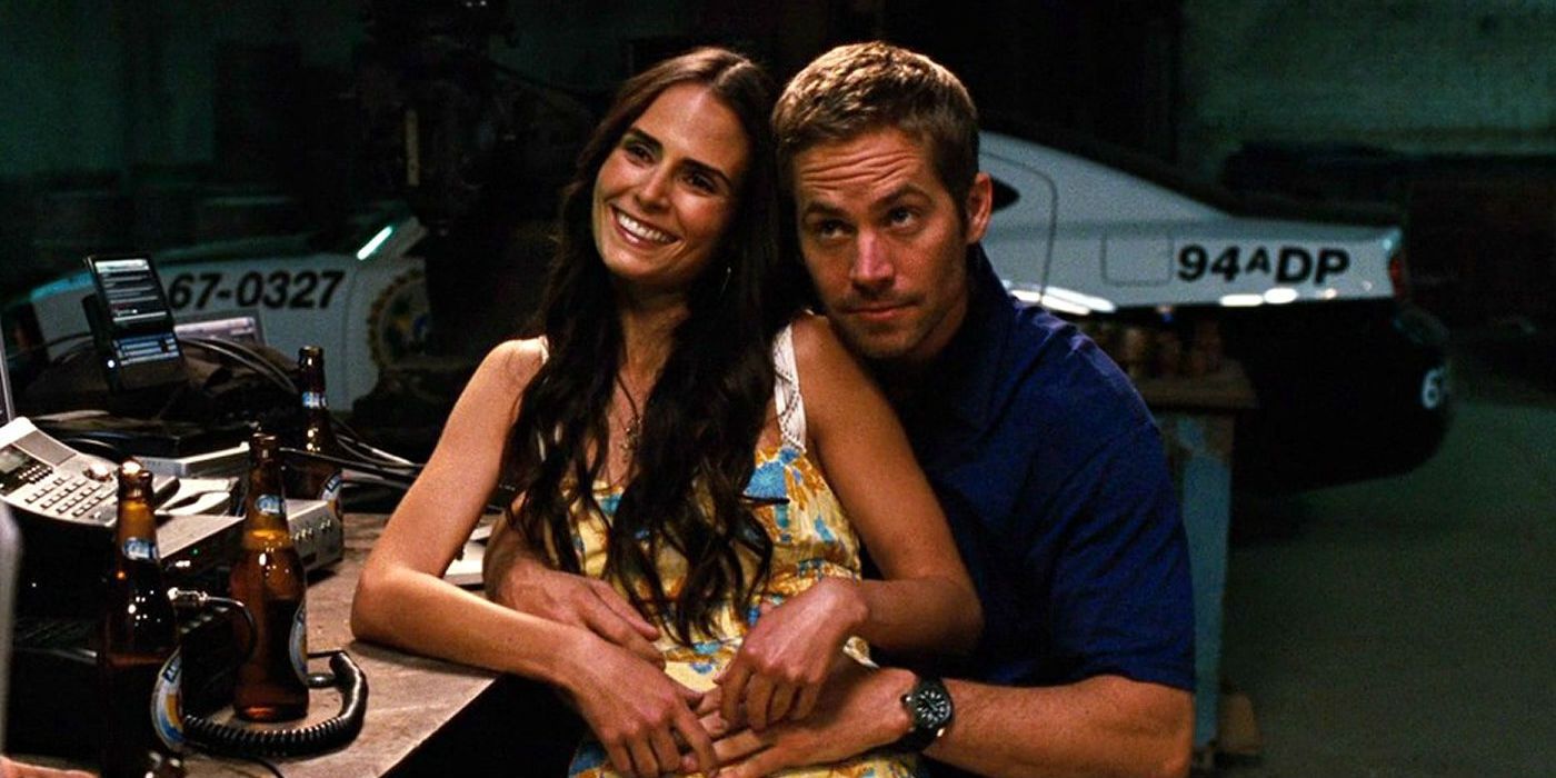Mia sits on Brian’s lap in Fast and Furious