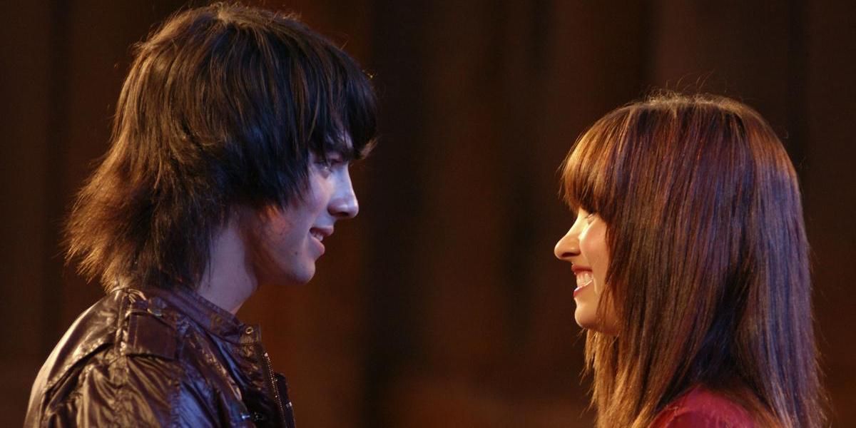 Shane and Mitchie smile at one another in Camp Rock