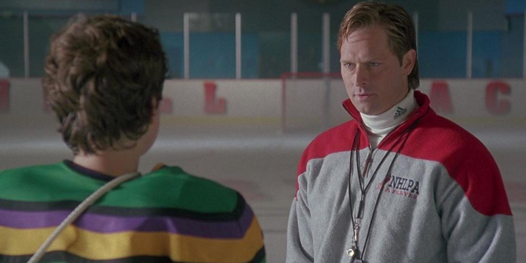 Coach Orion talks to Charlie on the ice during a practice session in D2 The Mighty Ducks