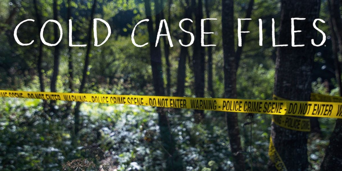 Police tape across trees with &quot;Cold Case Files&quot; written over it