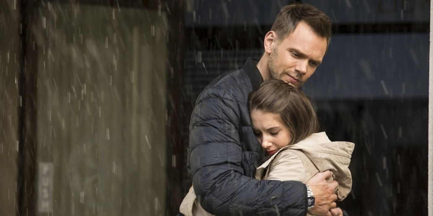 Jeff hugs Annie while the rain gently falls in Community.
