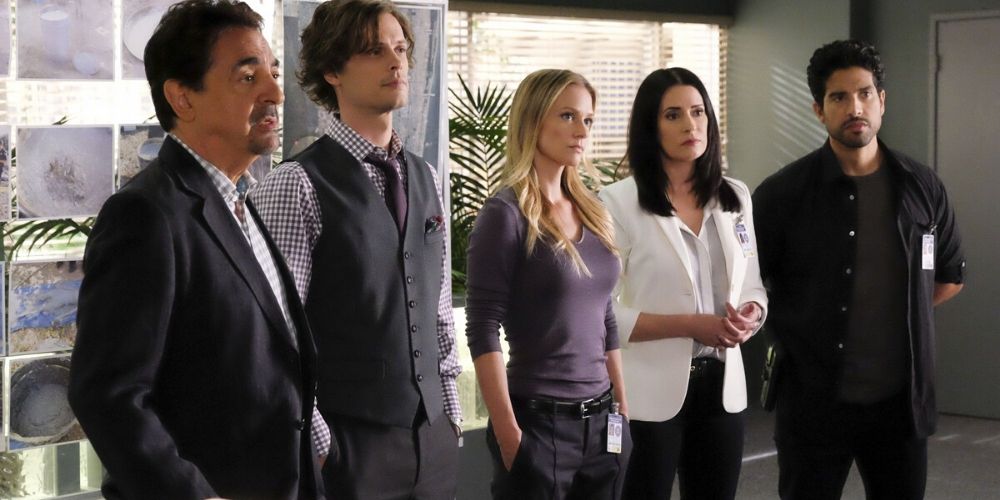 Criminal Minds main characters listening in a meeting